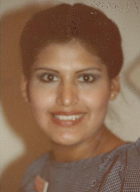 Noemi, pregnant with her son, Gilbert, stopped for a quick picture on campus in 1985.