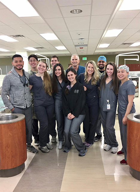 Jorge (left) with is clinical student group, general practice group 2.  Dakota Miller (front row: right of Jorge) and Tim Nguyen (back row: right of Jorge) also assisted on this case.<p>Photo taken pre-COVID-19.