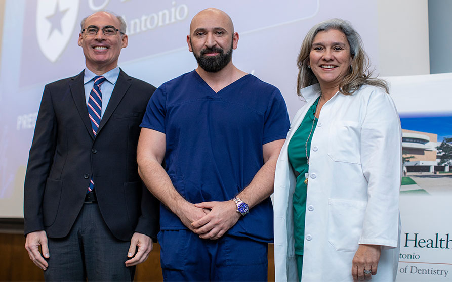 Dean Peter Loomer (left) and Dr. Adriana Segura (right) recognized Zeki Abdulaali (center) for his AY19-20 appointment as UT Health San Antonio Ambassador. <p>Photo Credit: Creative Media Services</p>