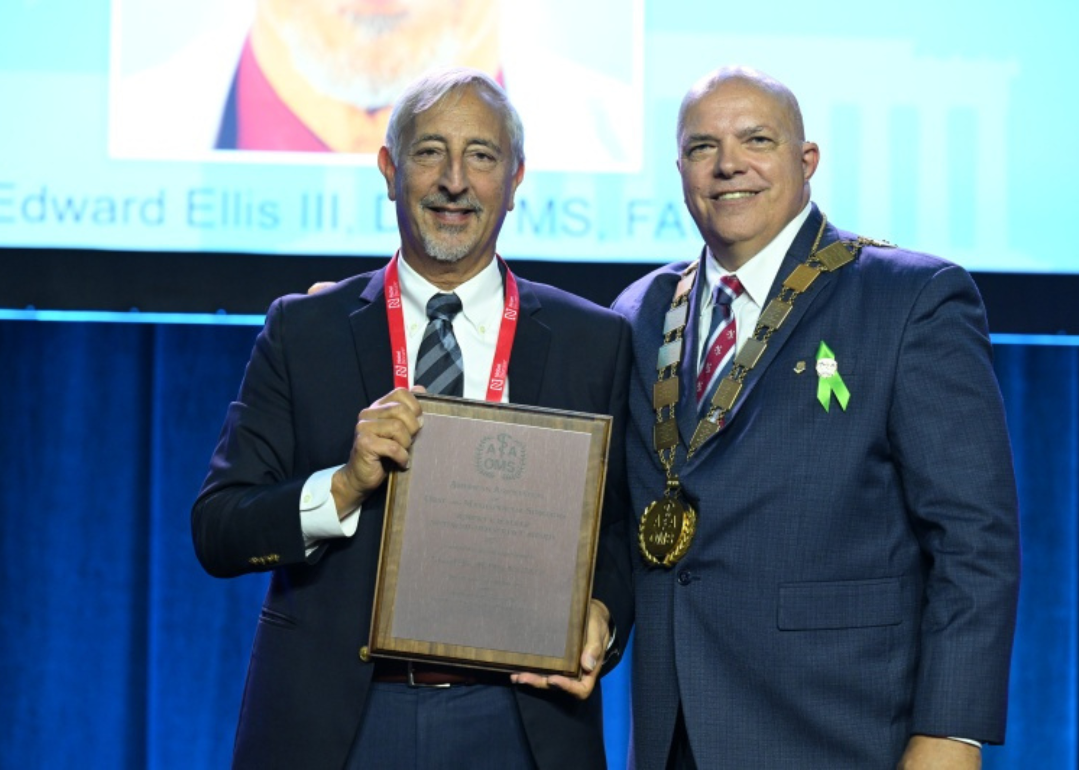 Edward Ellis III, DDS, MS, Chair of the Department of Oral and Maxillofacial Surgery, receiving the Robert V. Walker Distinguished Service Award at the American Association of Oral and Maxillofacial Surgeons Annual Meeting.