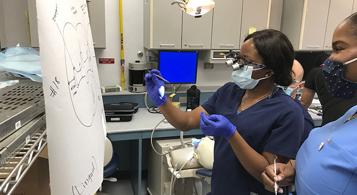 Dr. Uzoukwu providing instruction to a participant.