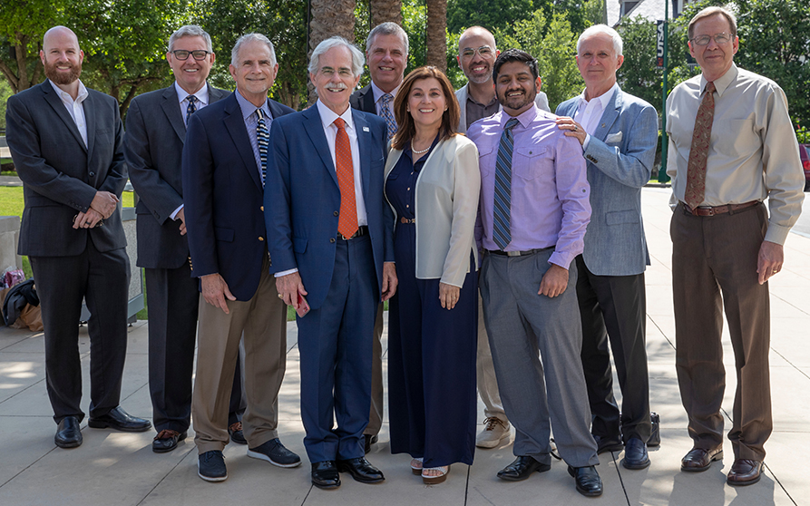 Dental Alumni Association's Past President, Dr. Joshua Seale (far left) with Dr. Wendell Edgin, President of the San Antonio District Dental Society, and Assistant Marshals Drs. Arthur Shaw, Fred Philips, Mark LittleStar, Adriana Green, Ahmed Sabbah, Niraj Patel, Kevin Gureckis, and David Cox (left to right).  Photo Credit: Creative Media Services