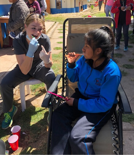 Kaymen Fryer, BSDH Class of 2022, demonstrates proper tooth brushing.