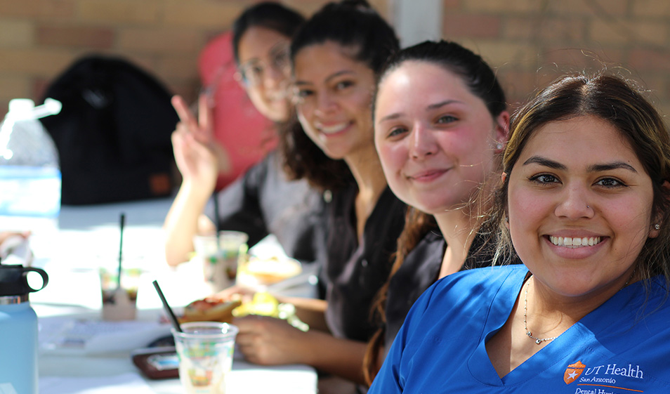dental students at evening dinner fuction outside