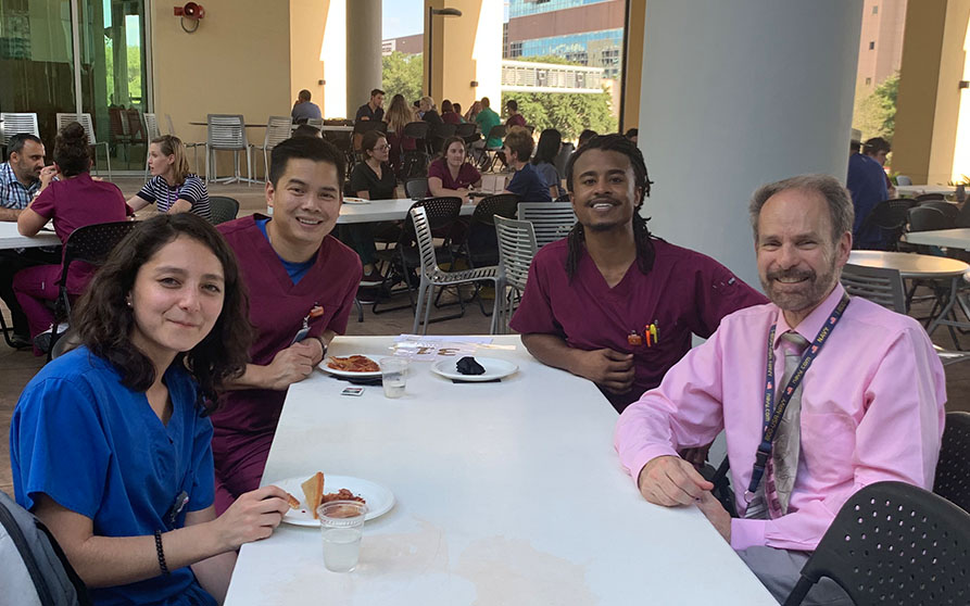 Dr. Robert Taft, Professor & Chair, Department of Comprehensive Dentistry meets with new DS1 advisees, Trinh Dinh (left back), Evan Edwards (right back), and Erin Egan (left front). 