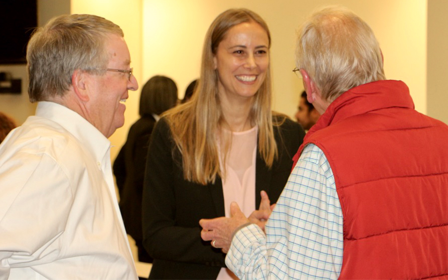 Dr. Marchesan (center) has post-lecture discussion with Dr. David Cochran (left) and Dr. Stephen Harris (right).