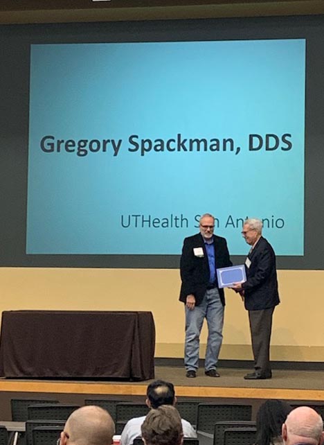 Dr. Kenneth Shine (right) inducts Dr. Gregory Spackman (left) into the Kenneth I. Shine, M.D., Academy of Health Science Education.