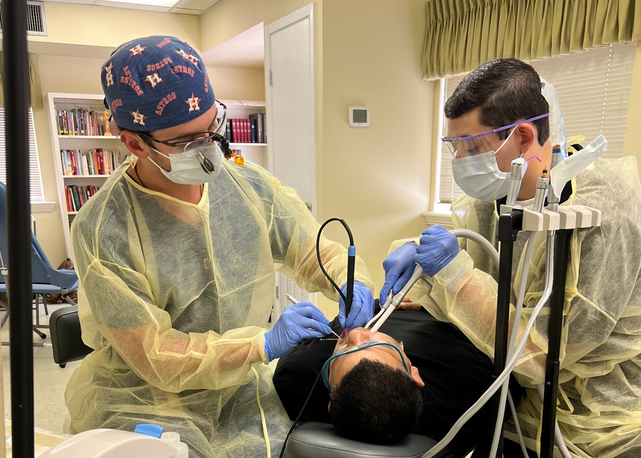 Dentist and assistant working on a patient