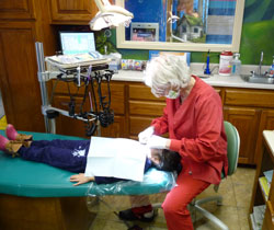 Cynthia Banker with a dental patient