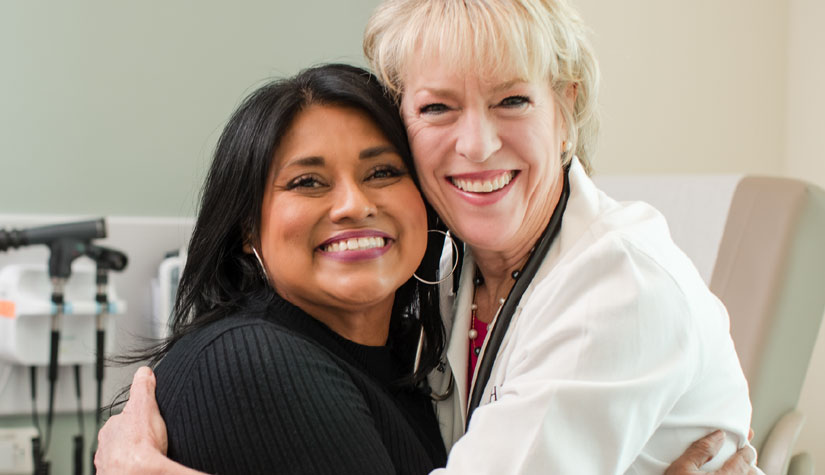 Photo of UT Health doctor with patient