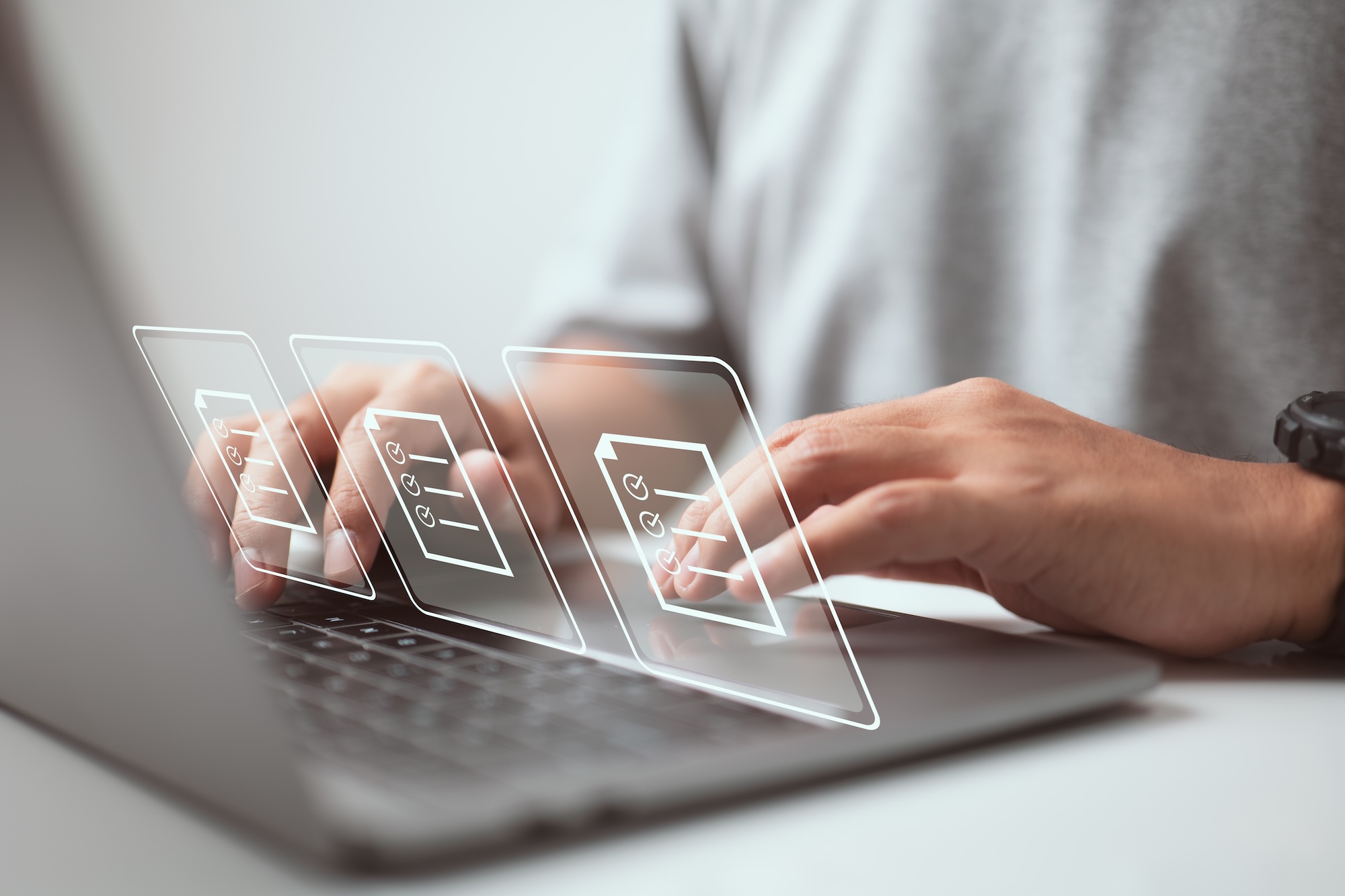 Set of hands on a laptop keyboard