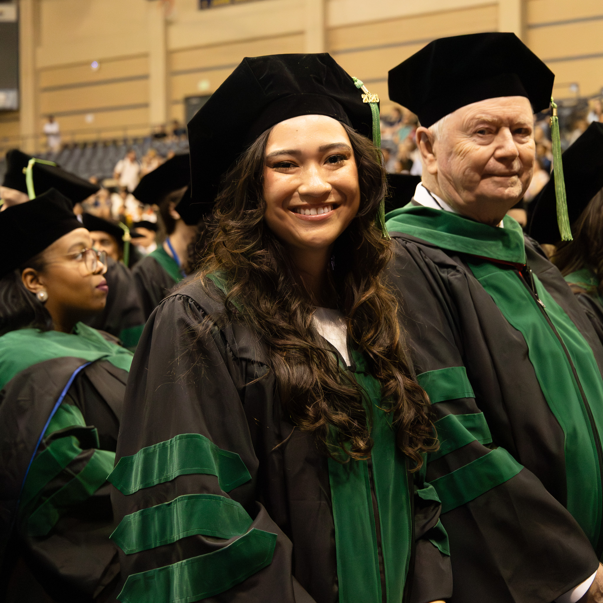 Graduating students smiling